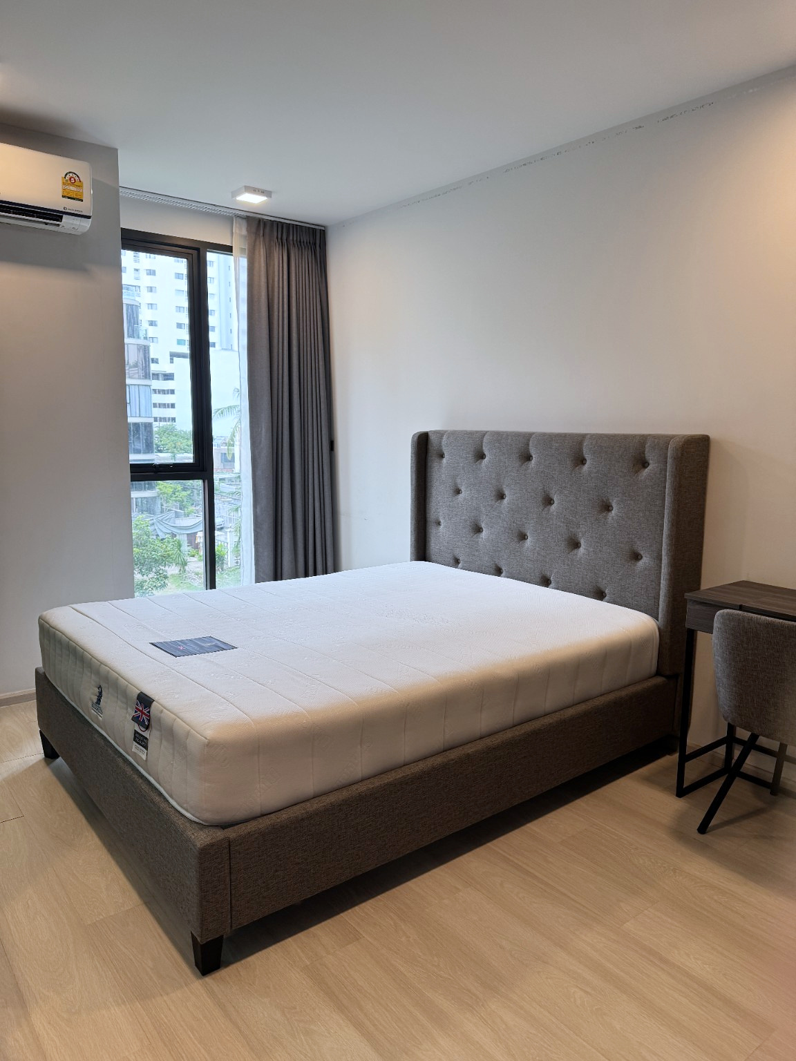 Furnished bedroom with a five-foot bed