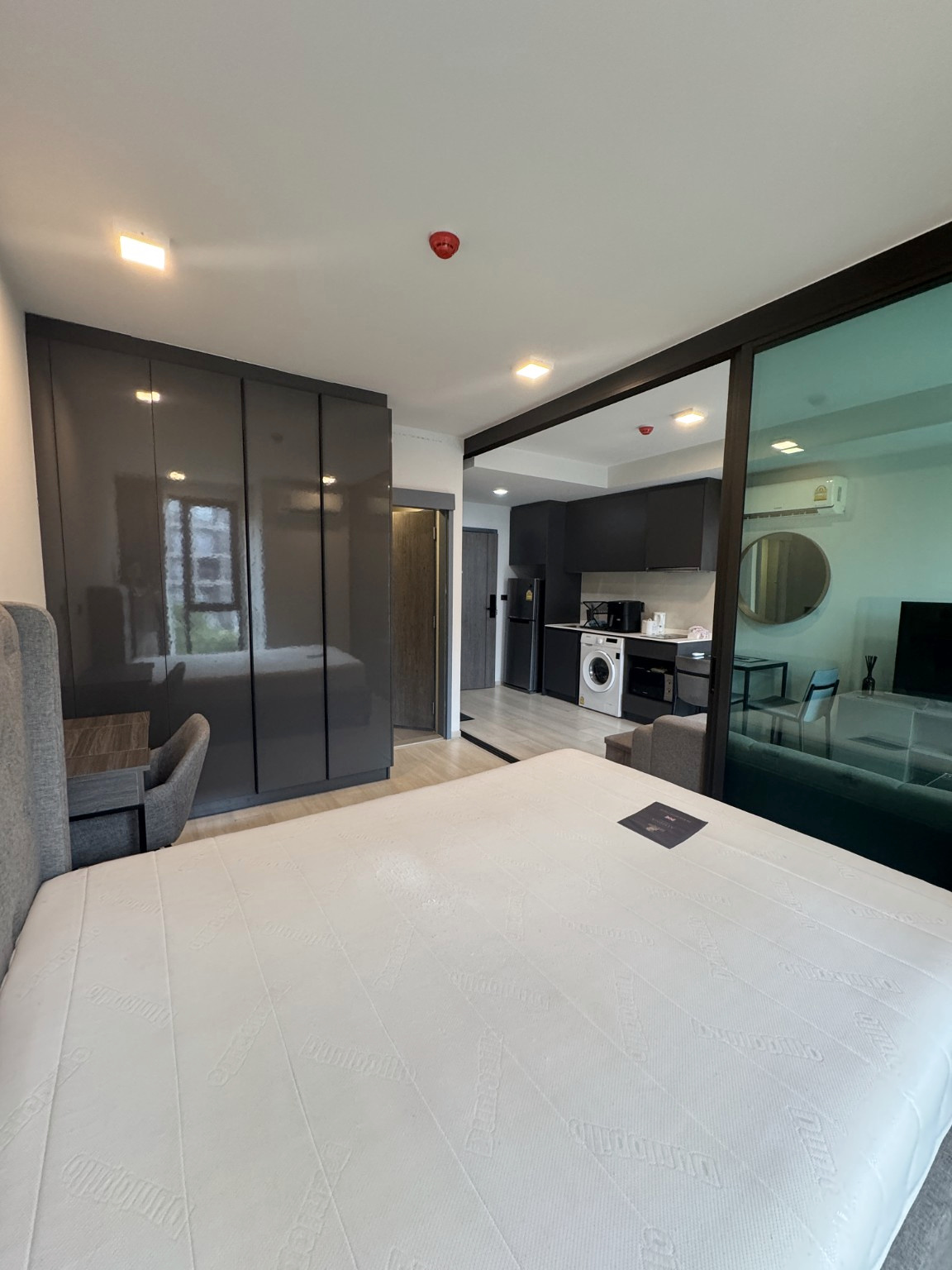 Bedroom view toward the living area and kitchenette